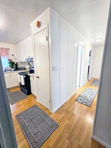 a view of kitchen island wooden floor