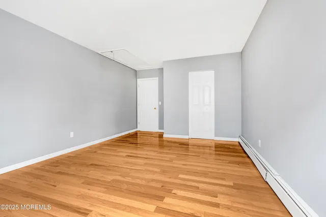 a bathroom with a tub shower vanity and a sink