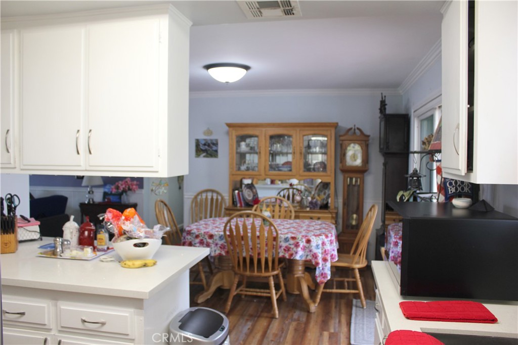 5911 Green Valley Road Riverside, CA 92504 - Photo 7 of 24 a view of a dining room with furniture and wooden floor