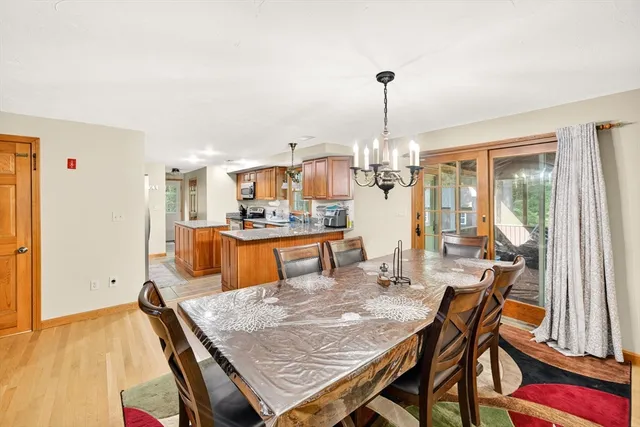 a dining table & chairs in a room
