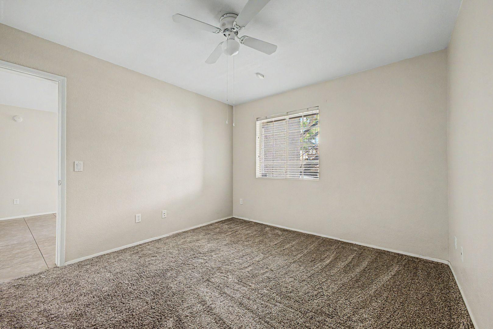 1720 East Thunderbird Road, Unit 1086 Phoenix, AZ 85022 - Photo 14 of 32 an empty room with windows