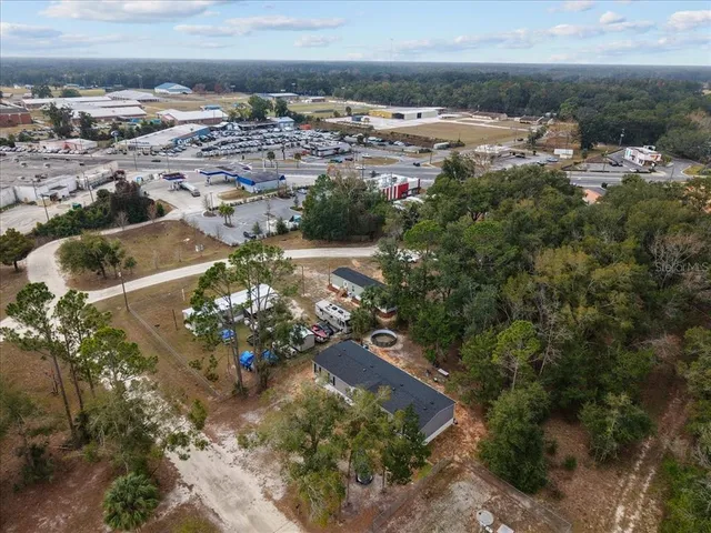 an aerial view of residential building and parking space
