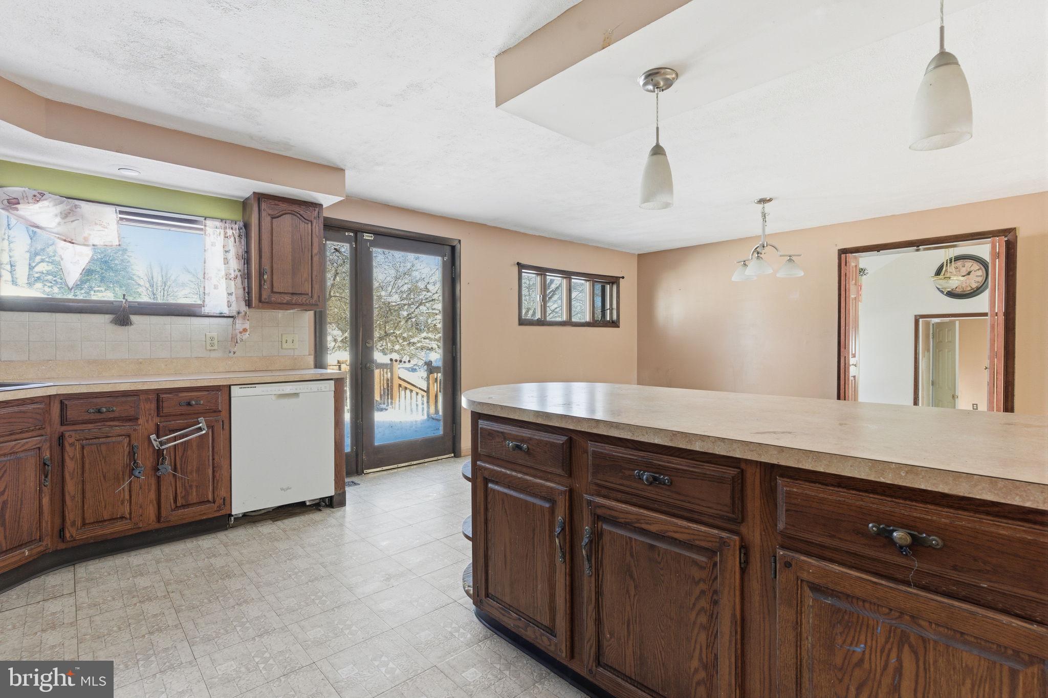 1057 Bridge Road Bensalem, PA 19020 - Photo 12 of 37 a spacious bathroom with a granite countertop sink and a mirror