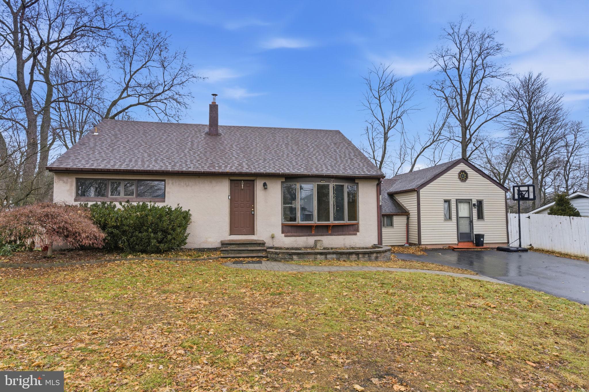 1057 Bridge Road Bensalem, PA 19020 - Photo 2 of 37 a front view of a house with a yard