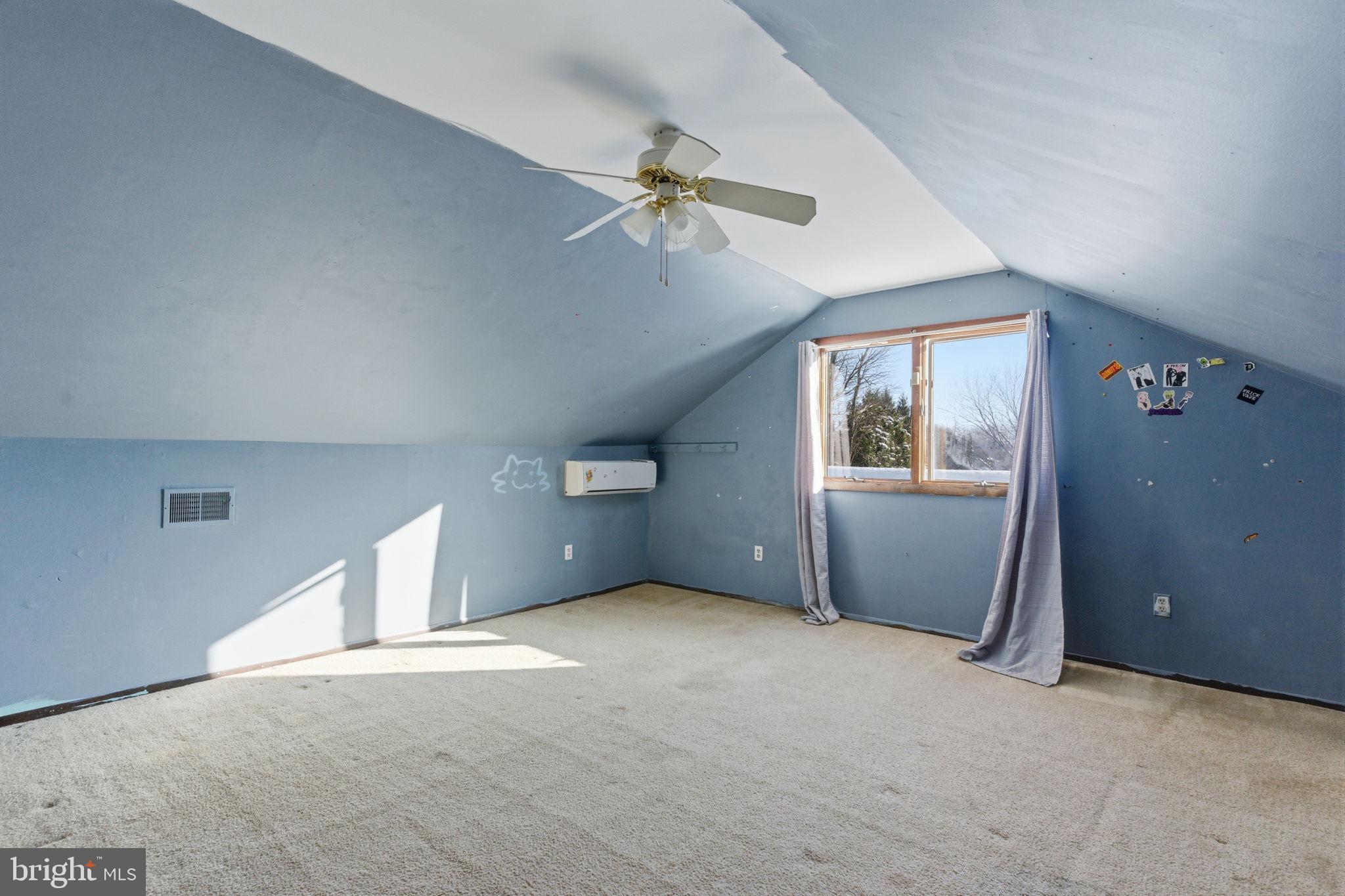 1057 Bridge Road Bensalem, PA 19020 - Photo 26 of 37 an empty room with windows and fan