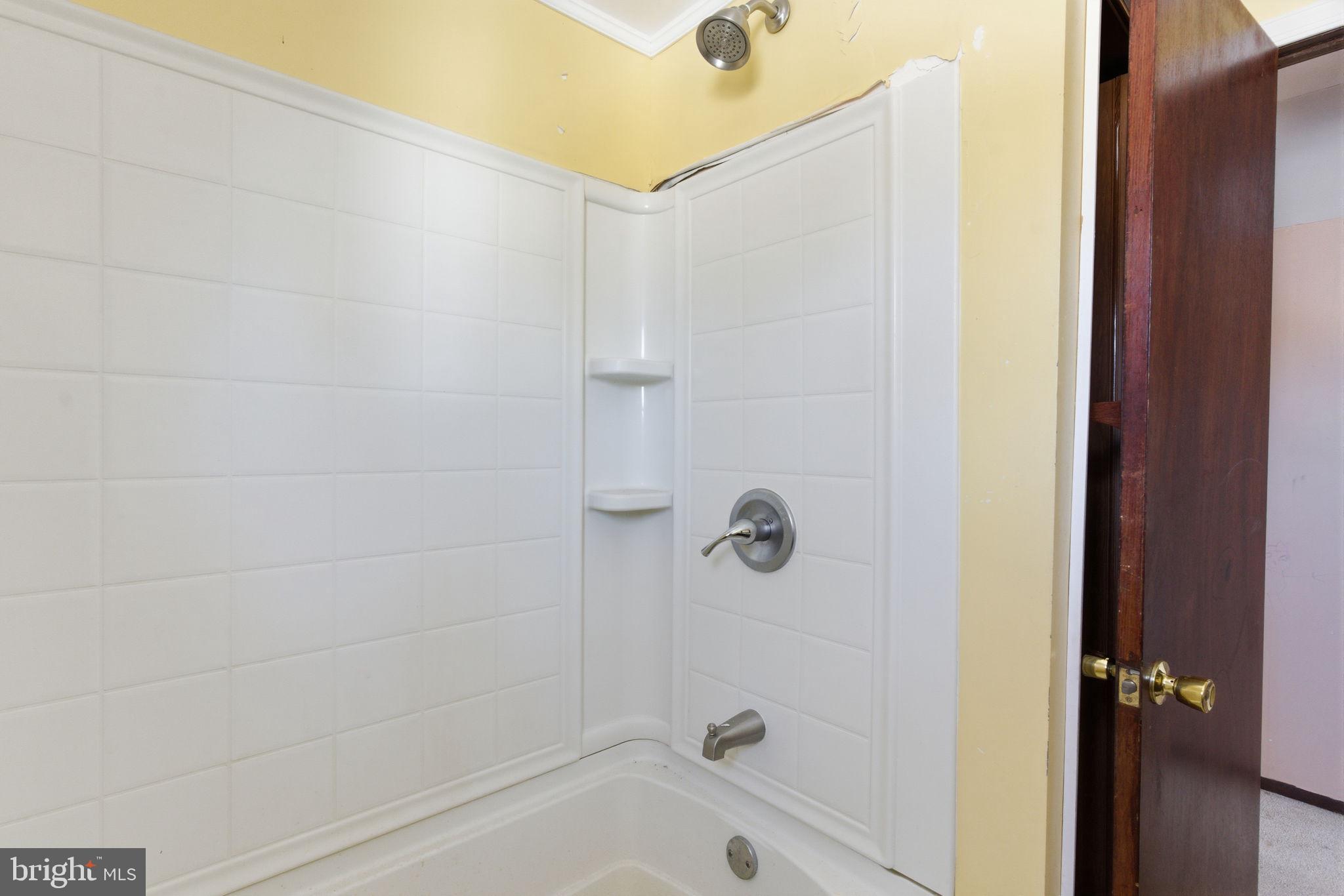 1057 Bridge Road Bensalem, PA 19020 - Photo 30 of 37 a bathroom with a shower