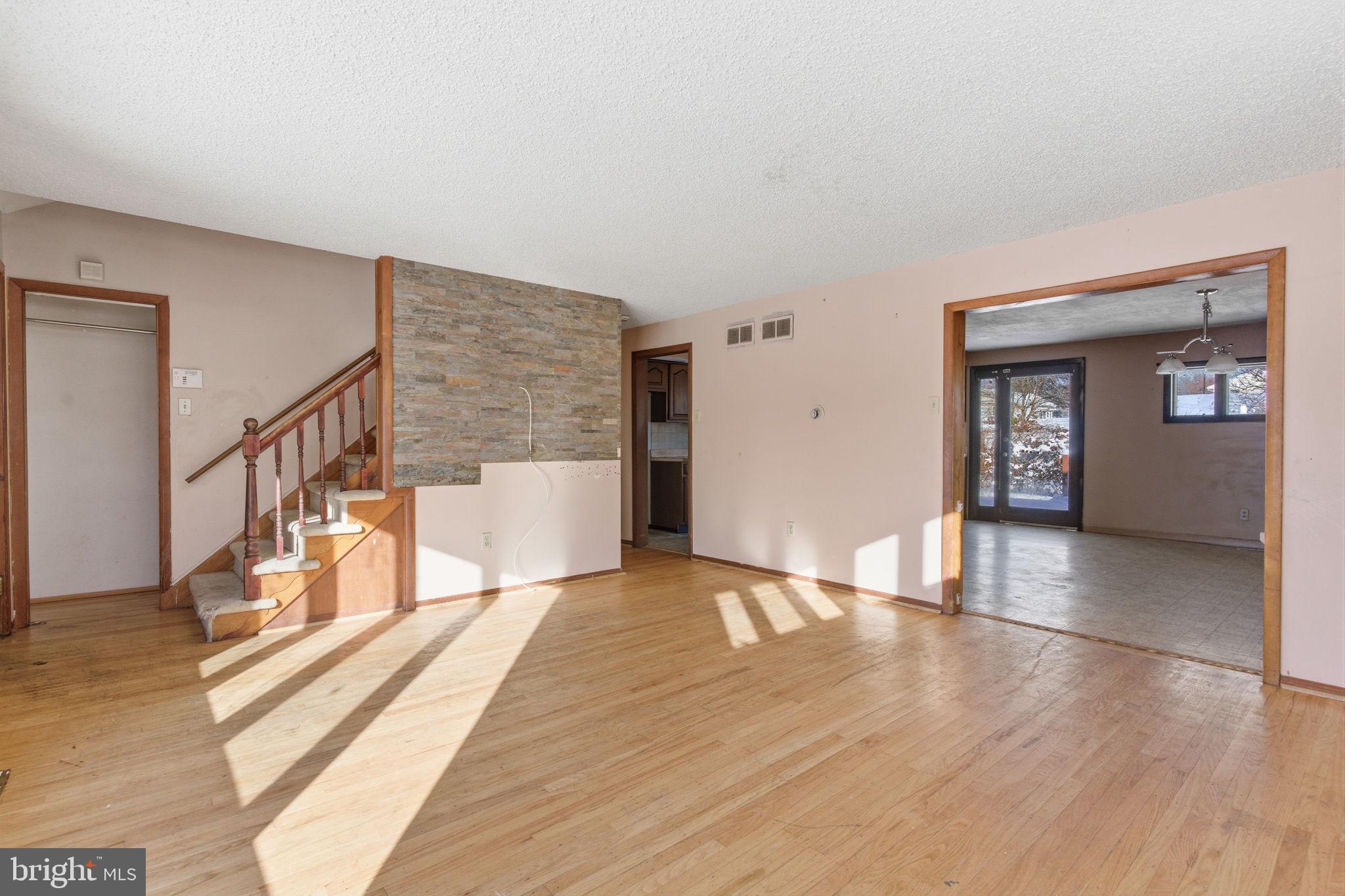 1057 Bridge Road Bensalem, PA 19020 - Photo 4 of 37 a view of an empty room with wooden floor and a potted plant