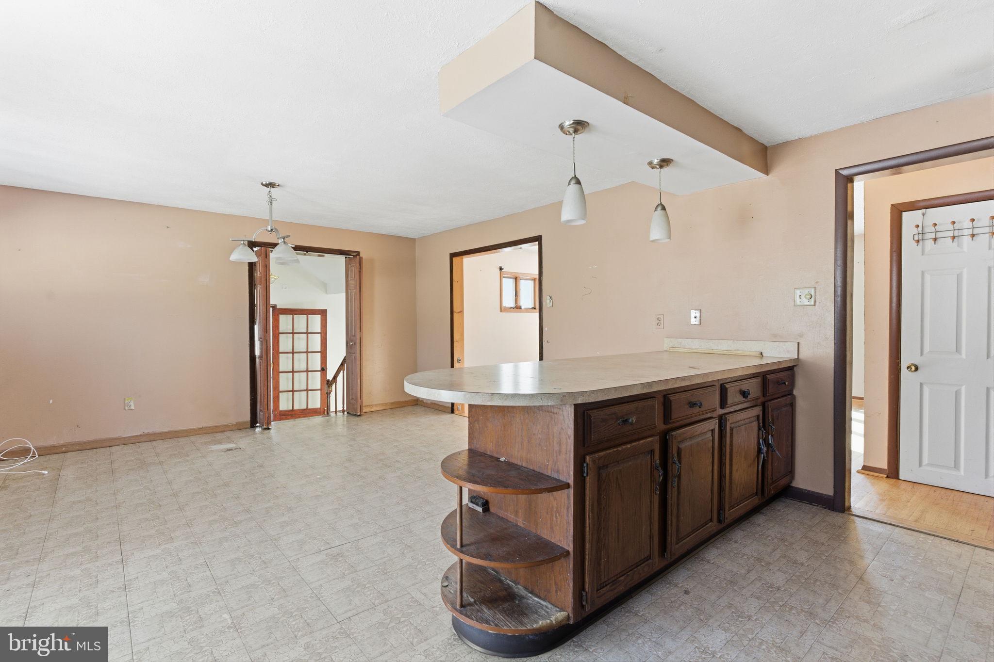 1057 Bridge Road Bensalem, PA 19020 - Photo 10 of 37 a kitchen with stainless steel appliances granite countertop a stove and a sink with cabinets