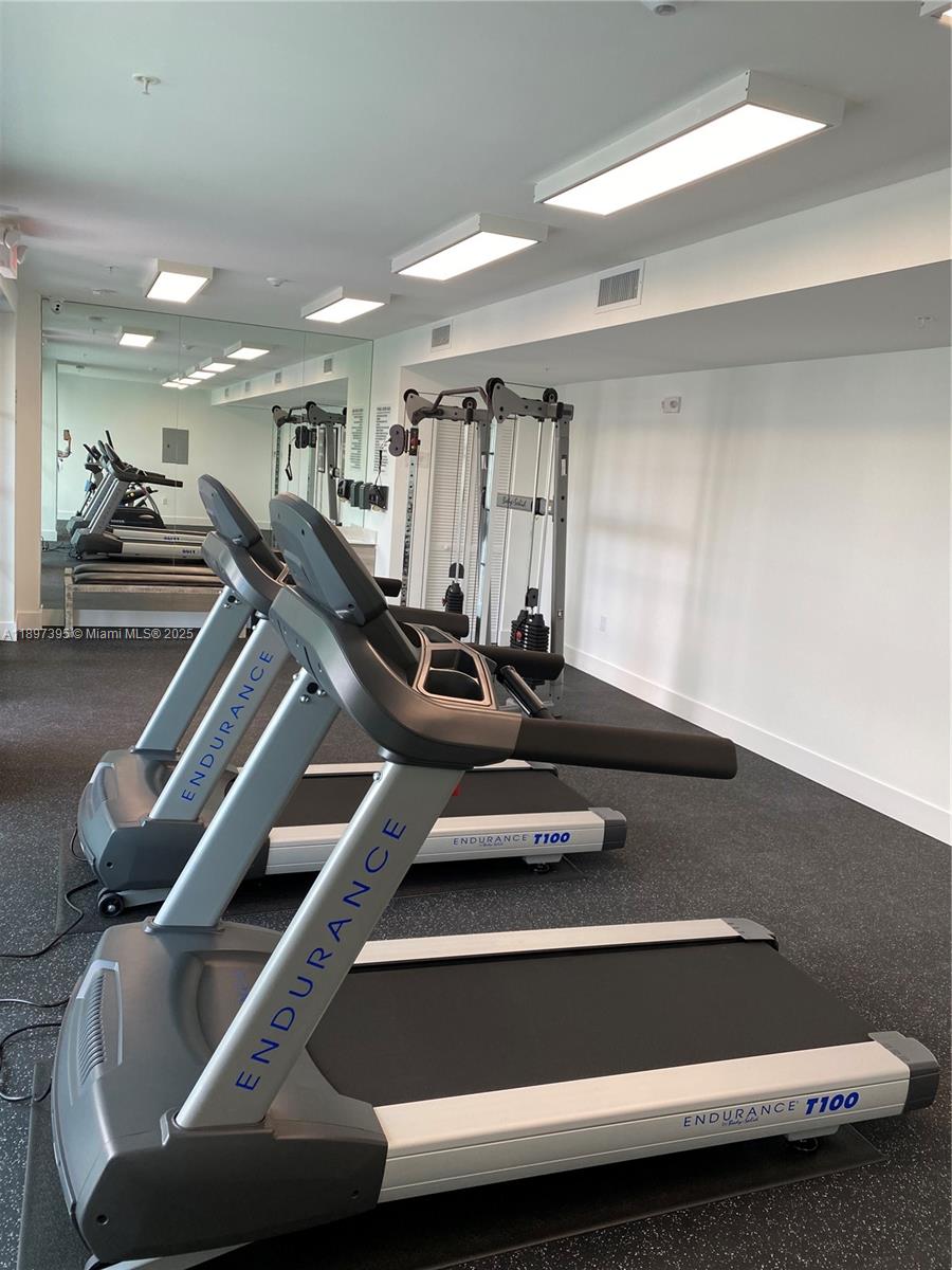 4100 Southwest 64th Avenue, Unit 314 Davie, FL 33314 - Photo 14 of 17 a room with gym equipment