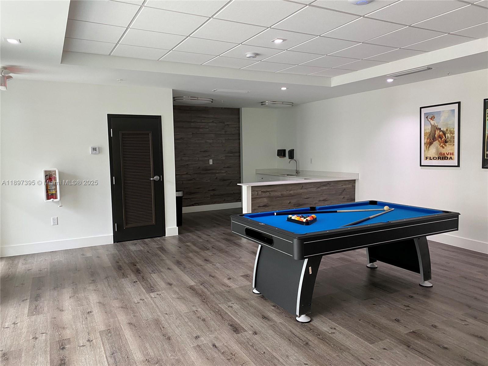 4100 Southwest 64th Avenue, Unit 314 Davie, FL 33314 - Photo 15 of 17 a room with furniture pool table and wooden floor
