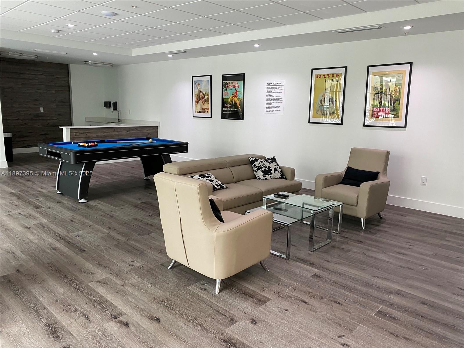 4100 Southwest 64th Avenue, Unit 314 Davie, FL 33314 - Photo 16 of 17 a living room with furniture and a wooden floor