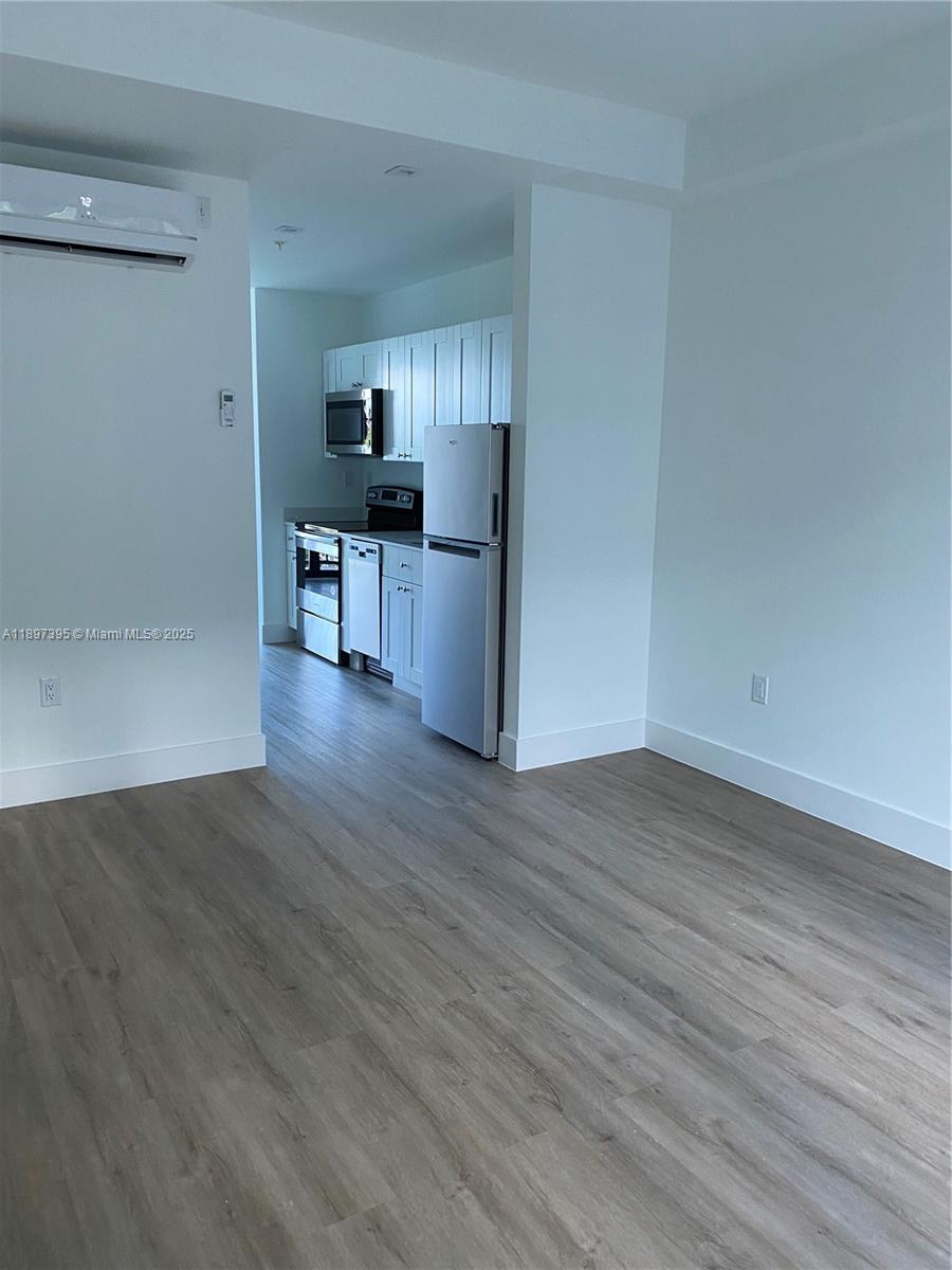 4100 Southwest 64th Avenue, Unit 314 Davie, FL 33314 - Photo 9 of 17 a view of a kitchen with wooden floor and a kitchen