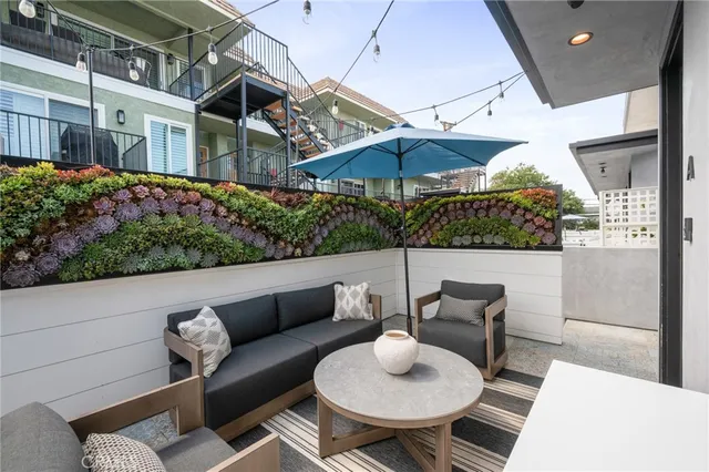 a patio with a table and chairs