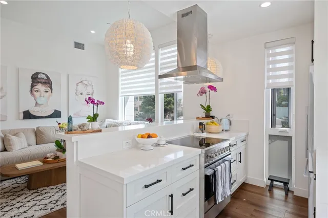 a view of kitchen and dining room with wooden floor