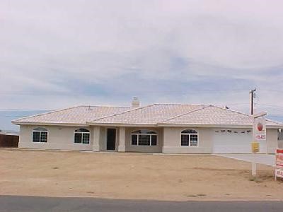 13804 Rincon Road, Unit 1 Apple Valley, CA 92307 - Photo 1 of 1 a front view of a house with a garage