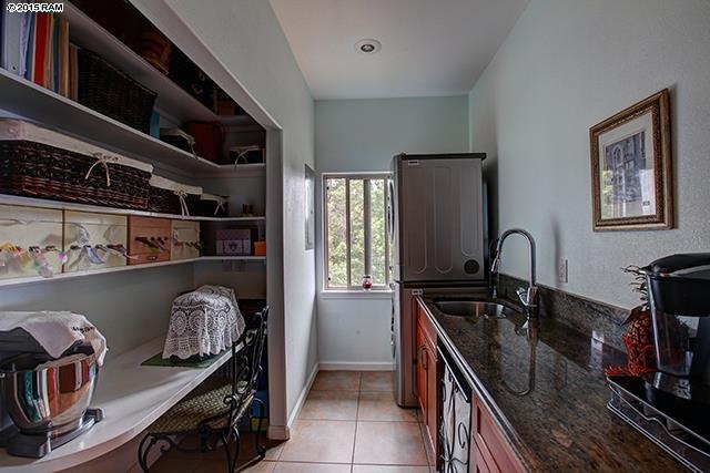 104 Cooke Road Kula, HI 96790 - Photo 11 of 22 a kitchen with granite countertop a stove and a sink