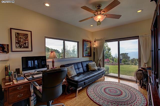104 Cooke Road Kula, HI 96790 - Photo 13 of 22 a living room with furniture and a floor to ceiling window