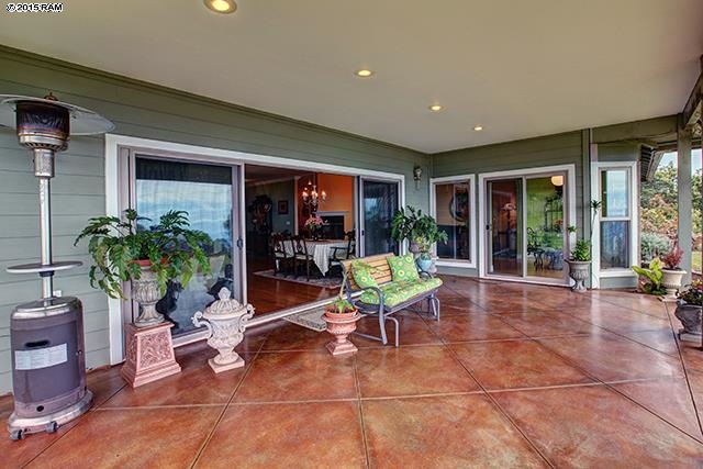 104 Cooke Road Kula, HI 96790 - Photo 15 of 22 a view of a work space with furniture and a potted plant