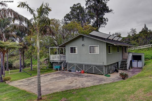 104 Cooke Road Kula, HI 96790 - Photo 18 of 22 a view of a house with a yard and sitting area