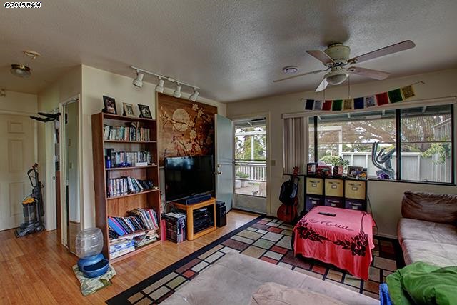 104 Cooke Road Kula, HI 96790 - Photo 20 of 22 a living room with lots of furniture and a flat screen tv