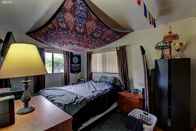 104 Cooke Road Kula, HI 96790 - Photo 21 of 22 a bedroom with a bed dresser and a large window