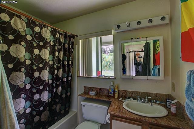 104 Cooke Road Kula, HI 96790 - Photo 22 of 22 a bathroom with a sink and a mirror