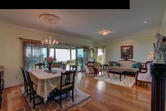 104 Cooke Road Kula, HI 96790 - Photo 3 of 22 a view of a dining room with furniture window and wooden floor