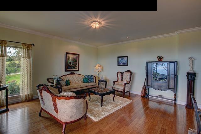 104 Cooke Road Kula, HI 96790 - Photo 4 of 22 a living room with furniture and a wooden floor