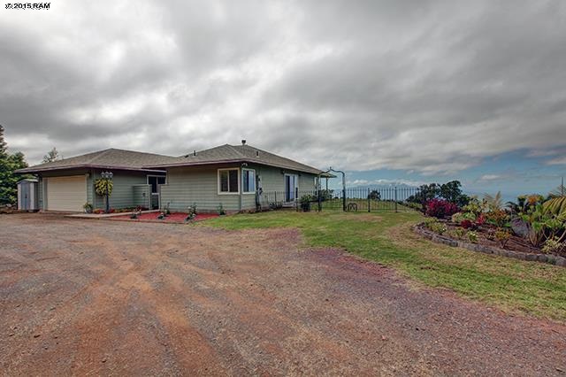 104 Cooke Road Kula, HI 96790 - Photo 6 of 22 a view of a house with a yard and garage