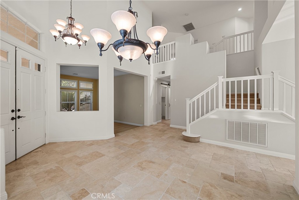25512 Wilde Avenue Stevenson Ranch, CA 91381 - Photo 11 of 53 a view of a livingroom with a chandelier fan