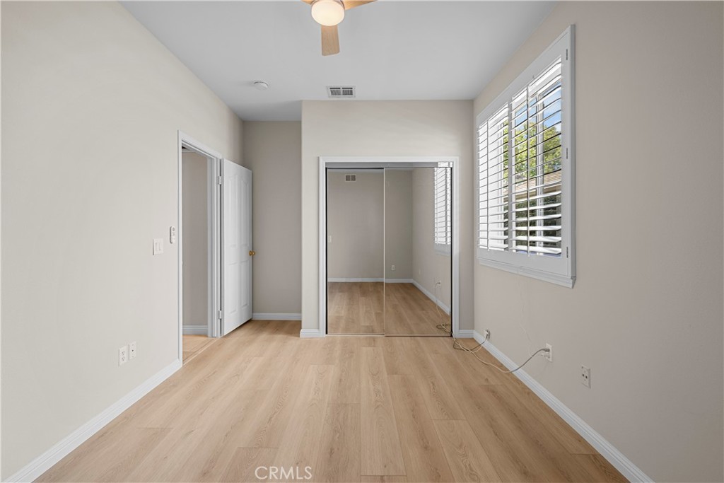 25512 Wilde Avenue Stevenson Ranch, CA 91381 - Photo 16 of 53 wooden floor in an empty room with a window