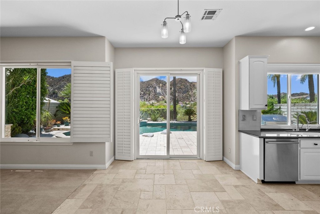 25512 Wilde Avenue Stevenson Ranch, CA 91381 - Photo 22 of 53 a view of a kitchen with a sink and a large window
