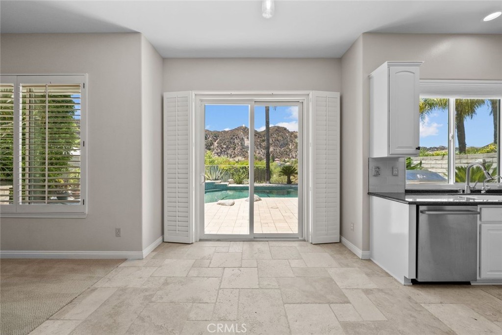 25512 Wilde Avenue Stevenson Ranch, CA 91381 - Photo 24 of 53 a kitchen with stainless steel appliances granite countertop a refrigerator and a sink