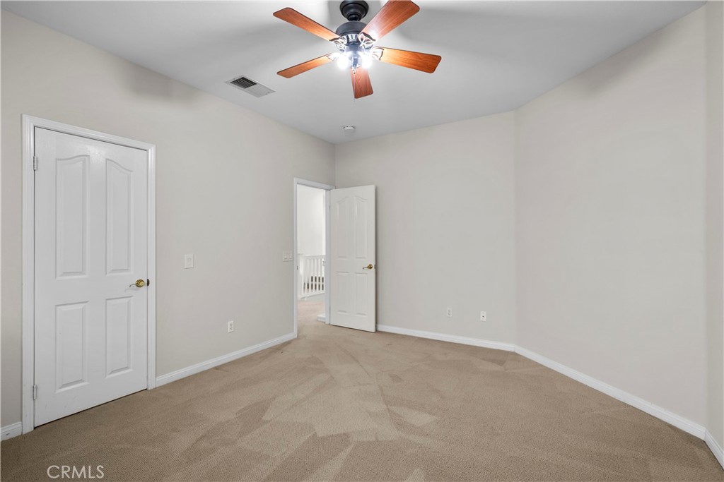 25512 Wilde Avenue Stevenson Ranch, CA 91381 - Photo 31 of 53 a view of an empty room and chandelier fan