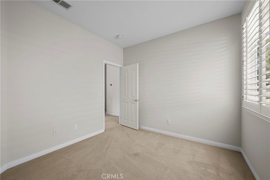 25512 Wilde Avenue Stevenson Ranch, CA 91381 - Photo 37 of 53 an empty room with windows