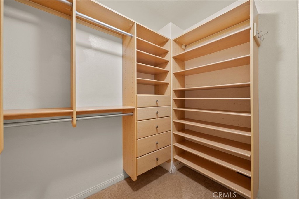 25512 Wilde Avenue Stevenson Ranch, CA 91381 - Photo 48 of 53 a view of walk in closet with empty racks