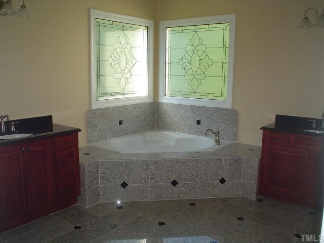 7321 Newport Avenue Raleigh, NC 27613 - Photo 5 of 5 a view of bathroom with dual sinks