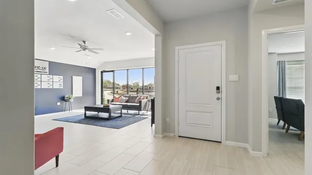 a bathroom with a shower and a glass door
