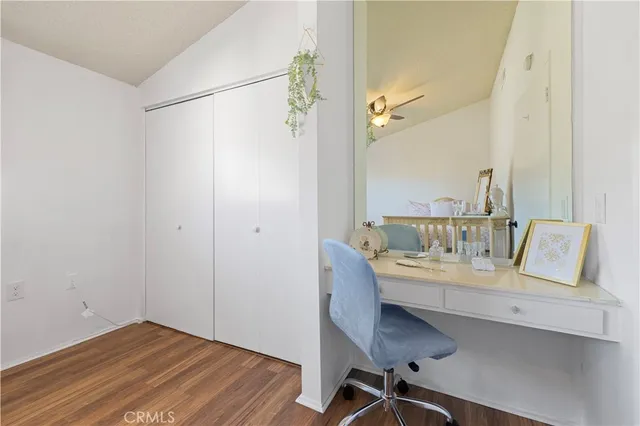 a workspace with furniture and wooden floor