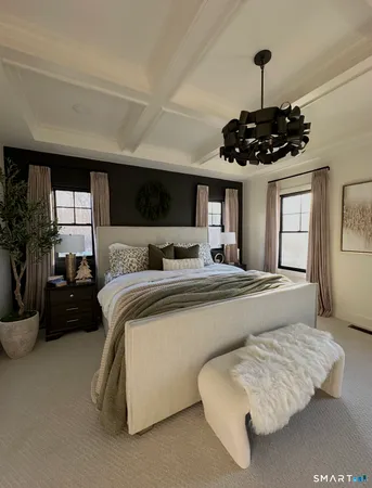 a bedroom with bed and window