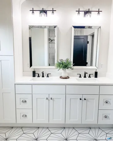 a bathroom with double sink and a mirror