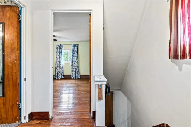 a view of entryway with wooden floor