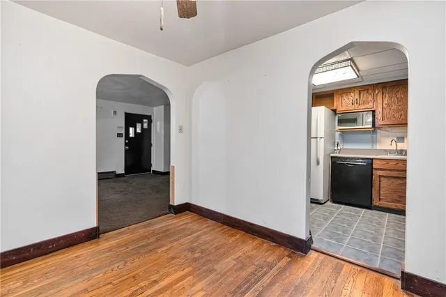 a view of a kitchen from the hallway