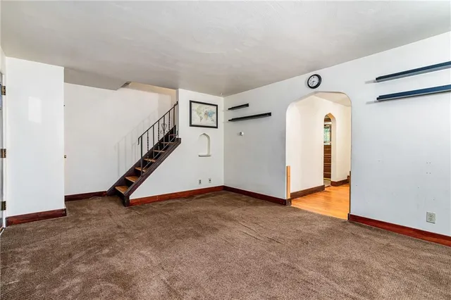 a view of an empty room with stairs