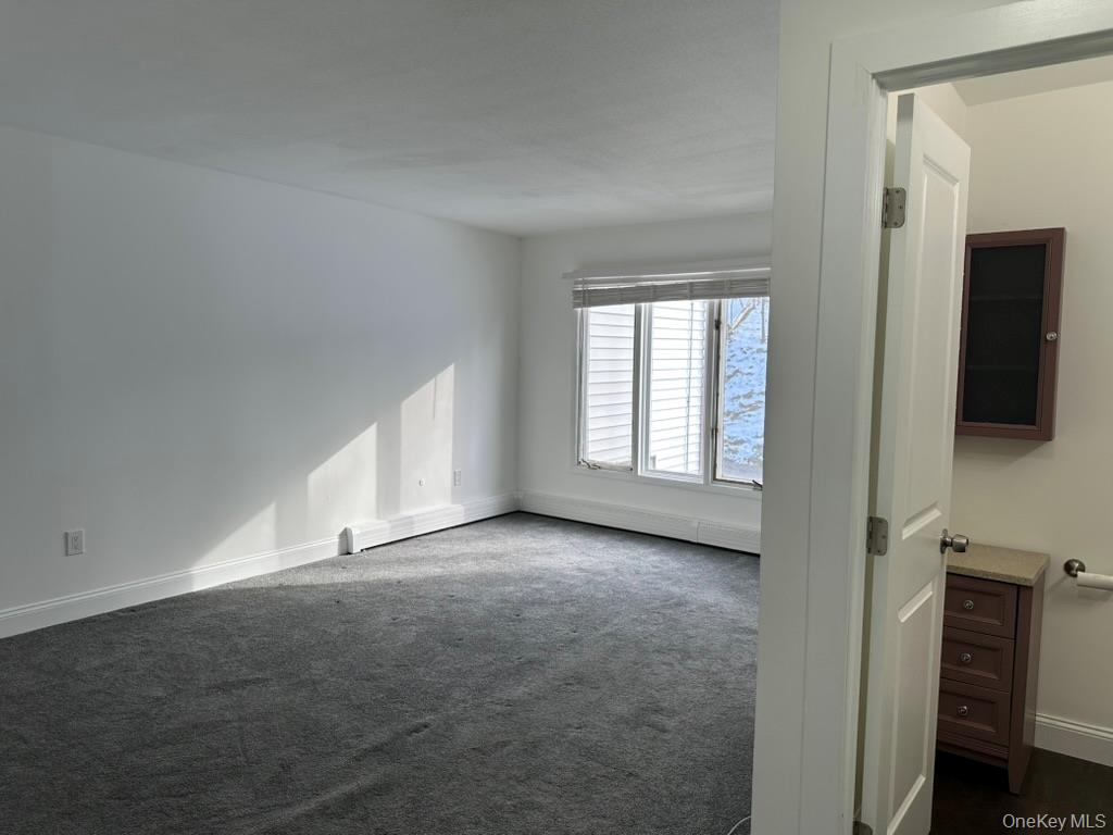 3 Hook Road, Unit 72K Poughkeepsie, NY 12601 - Photo 12 of 13 primary bedroom with half bath and walk in closet