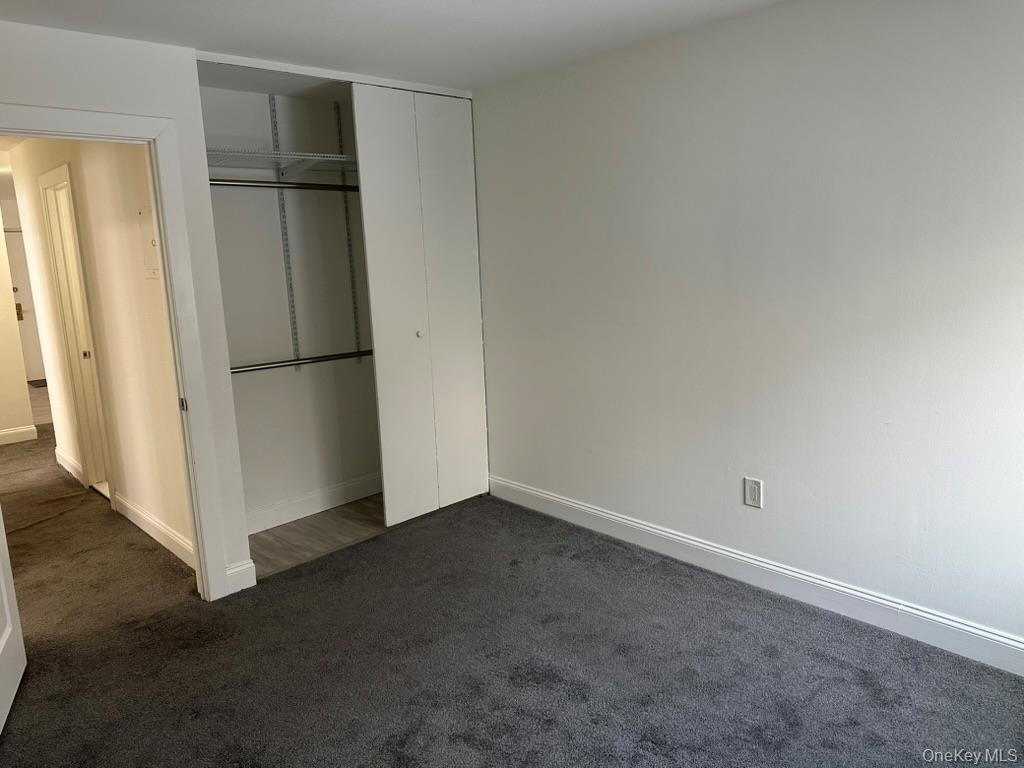 3 Hook Road, Unit 72K Poughkeepsie, NY 12601 - Photo 10 of 13 bedroom with dark carpet and a closet