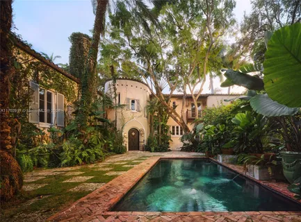 a view of swimming pool with a yard