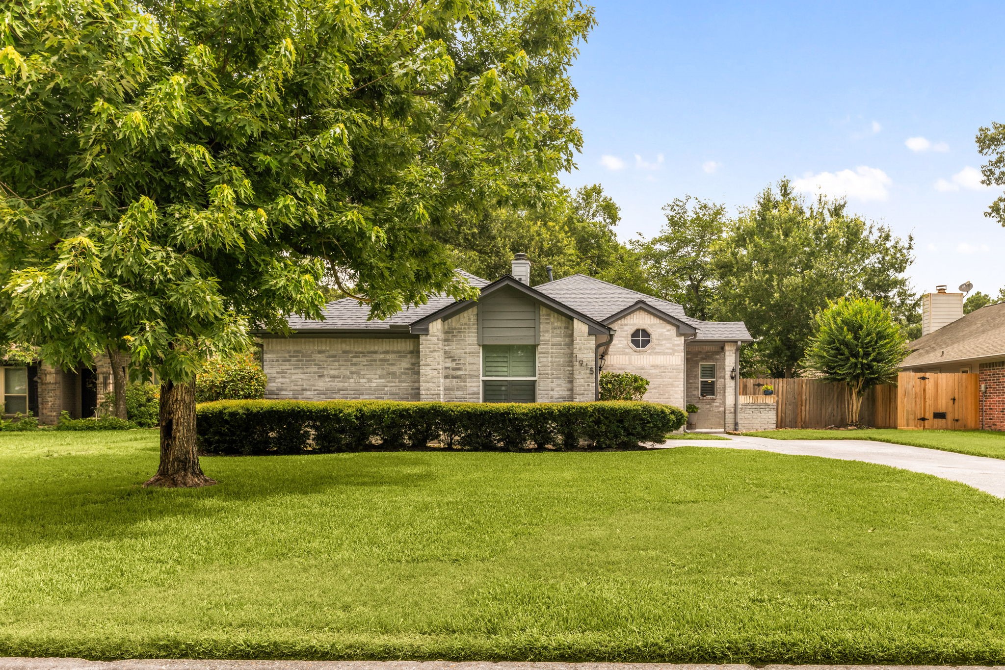 1915 Mercoal Drive Spring, TX 77386 - Photo 6 of 50 Spacious front yard with established landscaping and excellent curb appeal.