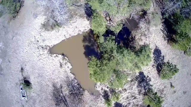 a view of a lake with a yard