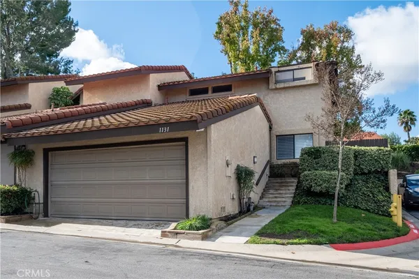 a front view of a house with a garage